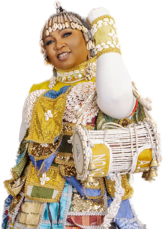 Ara in traditional Yoruba performance attire with a talking drum